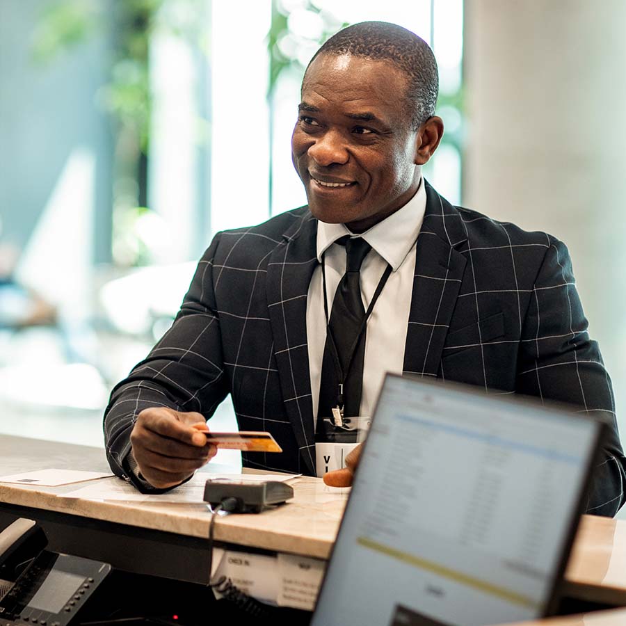 Businessman paying for hotel