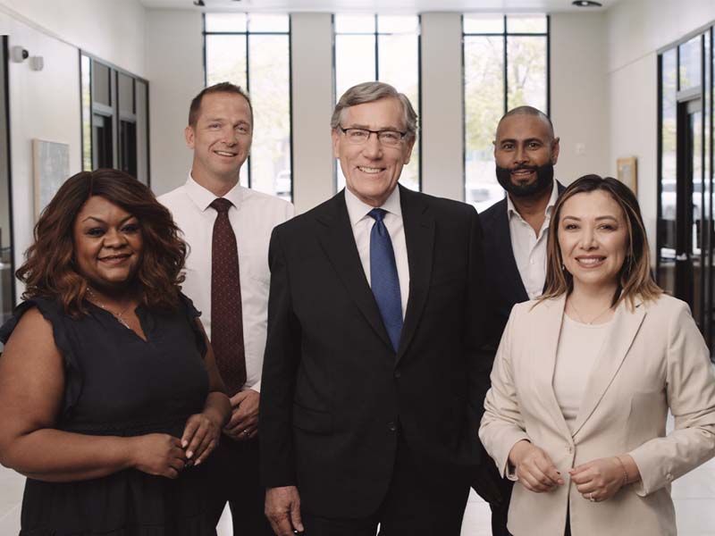 Zions employees standing with Scott Anderson